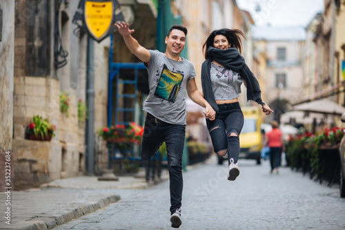 young couple posing on city background, travel concept