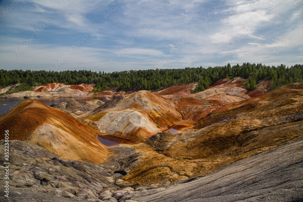 Obraz premium Amazing kaolin clay marsian landscape quarry open pit at summer day