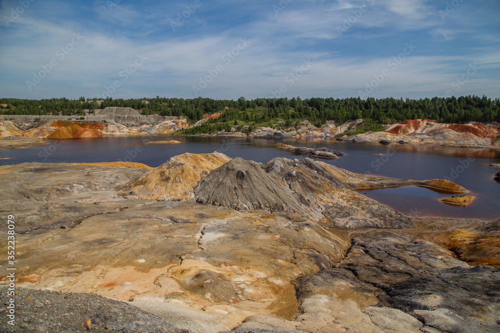 Obraz premium Amazing kaolin clay marsian landscape quarry open pit at summer day