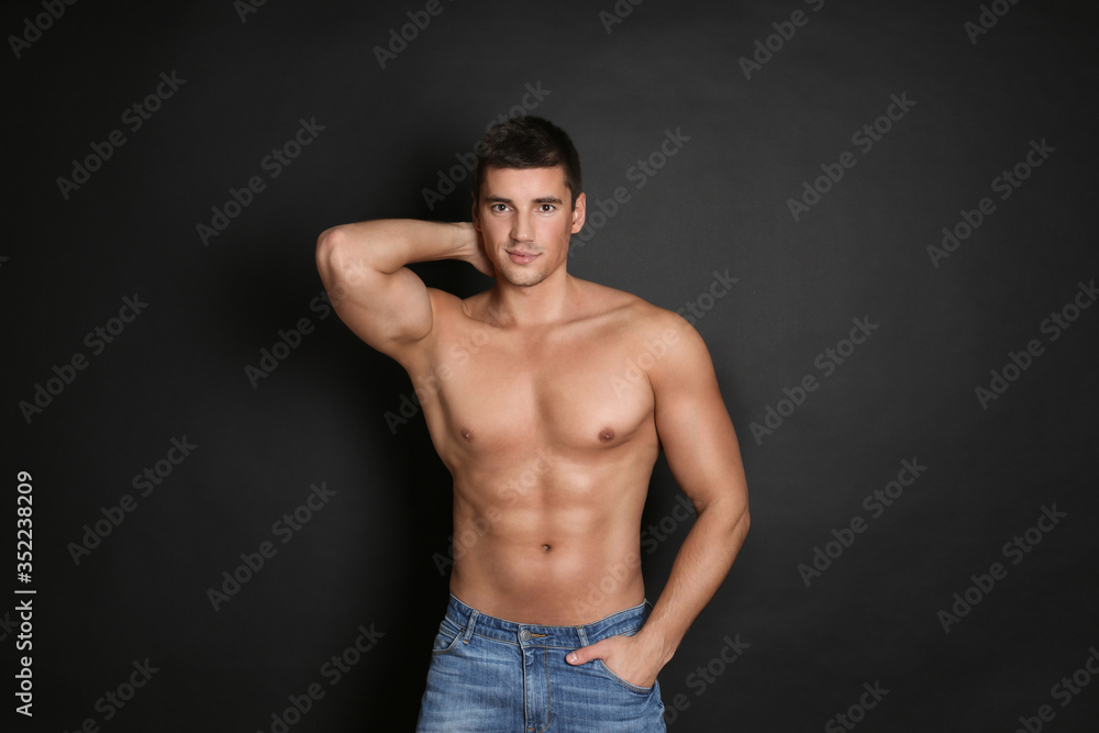 Man with sexy body on black background