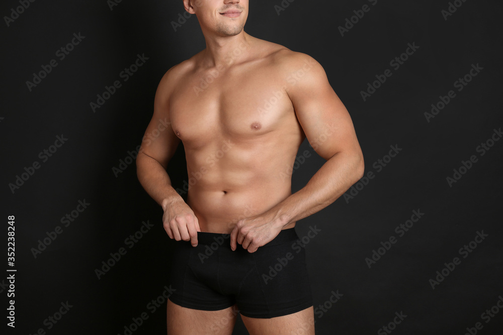 Man with sexy body on black background, closeup Man with sexy body on black background, closeup