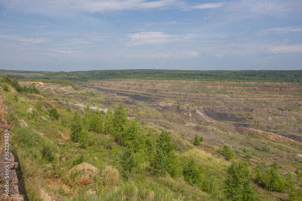 Abandoned coal ore quarry open pit