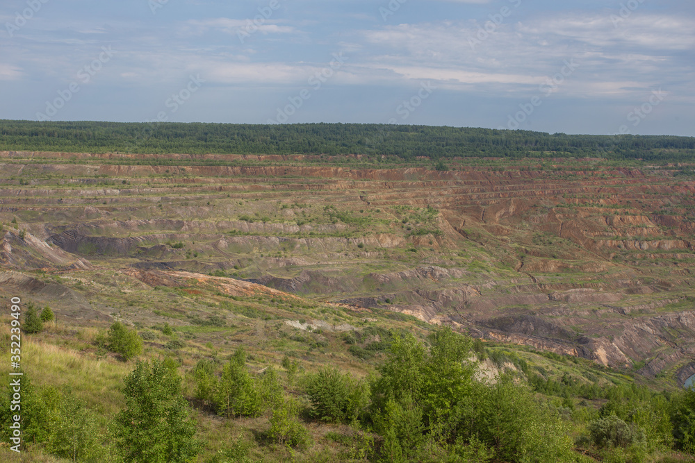 Abandoned coal ore quarry open pit