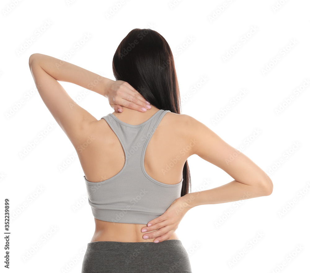Woman suffering from pain in back on white background. Visiting orthopedist Woman suffering from pain in back on white background. Visiting orthopedist