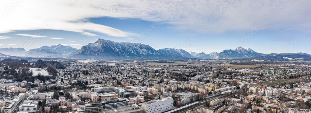 Panoramic aerial drone shot view of Salzburg aiglhof station with view of eastern bavarian alps mountain