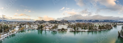 Aerial drone shot view of Leopoldskroner lake southwest of outskirts of Salzburg during winter photo