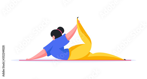 Modern woman doing yoga exercise on mat