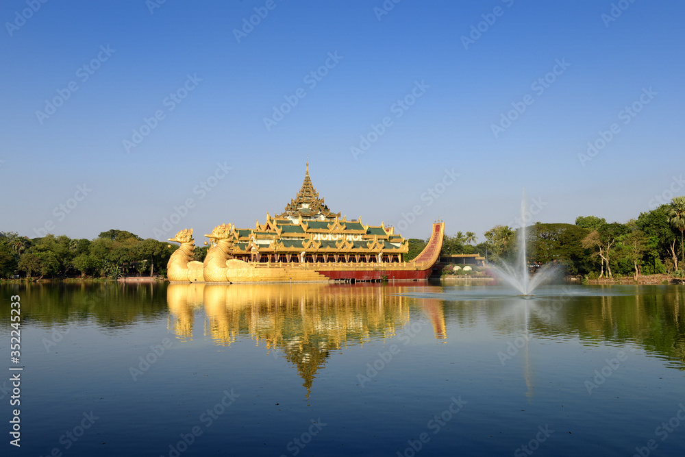 Burmese royal barge Golden Karaweik palace on Kandawgyi Lake in Bogyoke Park in Yangon, Myanmar (Burma) Burmese royal barge Golden Karaweik palace on Kandawgyi Lake in Bogyoke Park in Yangon, Myanmar (Burma)