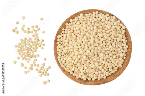 white quinoa seeds in wooden bowl isolated on white background with clipping path and full depth of field. Top view. Flat lay.
