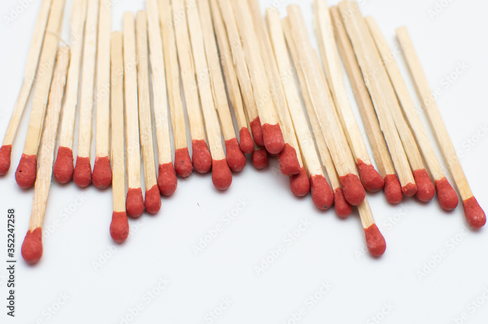 Bunch of matchsticks placed close to each other Bunch of matchsticks placed close to each other