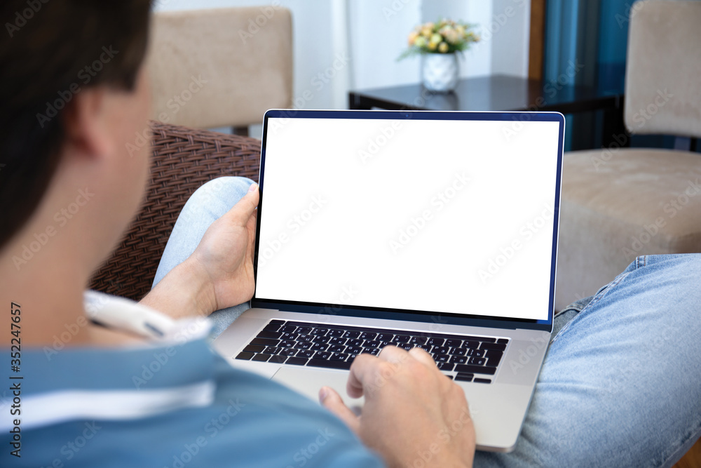 man working on laptop with isolated screen at home man working on laptop with isolated screen at home