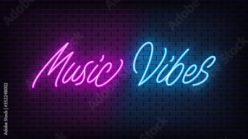 Neon Music Vibes, lettering. Neon text of Music Vibes on black brick background