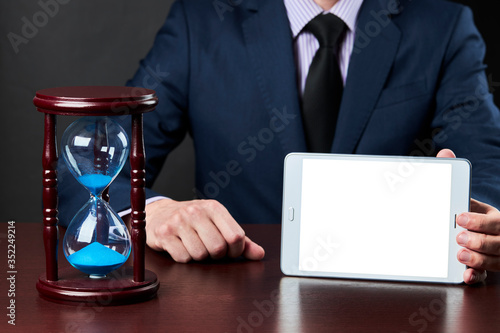 a businessman shows tablet display. business communication technology mockup. template for design