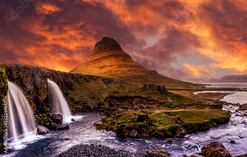 Incredible Nature landscape of Iceland. Fantastic picturesque sunset over Majestic Kirkjufell mountain and waterfalls. Church mountain  Iceland. Iceland the most beautiful and best travel place.