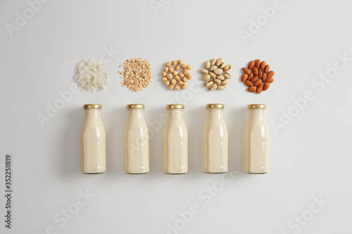 Vegetable white milk made of cocnut, oat, hazelnut, pistachio and almond. Ingredients for preparing vegetarian beverage. Product contains good amount of protein, vitamin D, calcium. Healthy drink