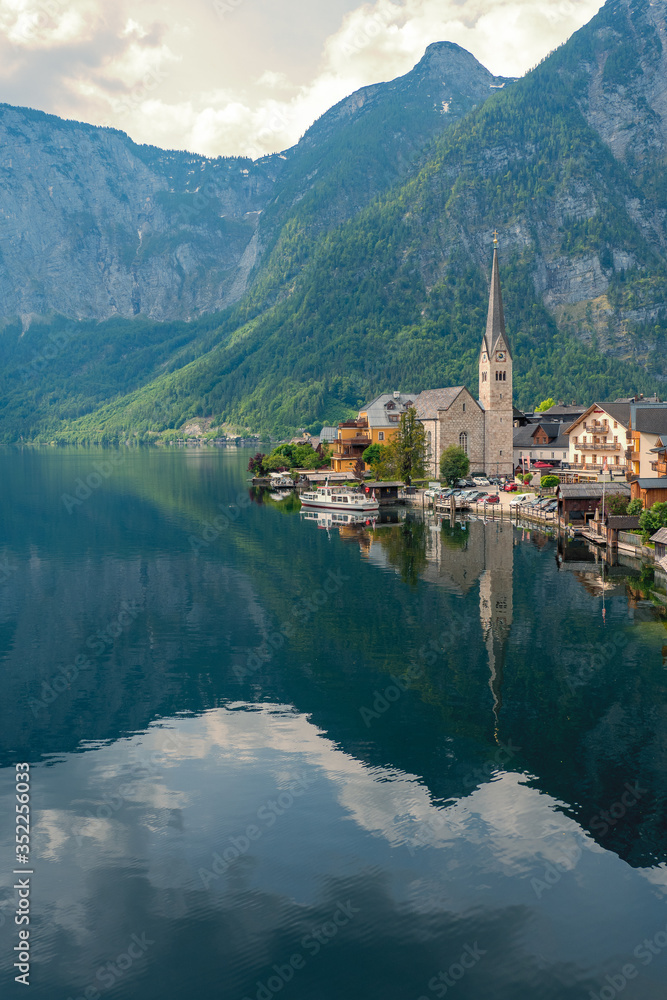 Scenic view of the Evangelical church at the waterfront of the famous mountain village Hallstatt in the Salzkammergut region, OÖ, Austria