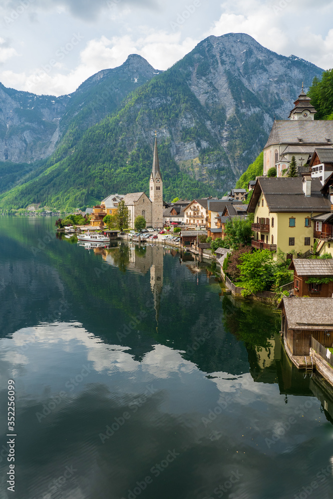 Scenic view of the Evangelical church at the waterfront of the famous mountain village Hallstatt in the Salzkammergut region, OÖ, Austria
