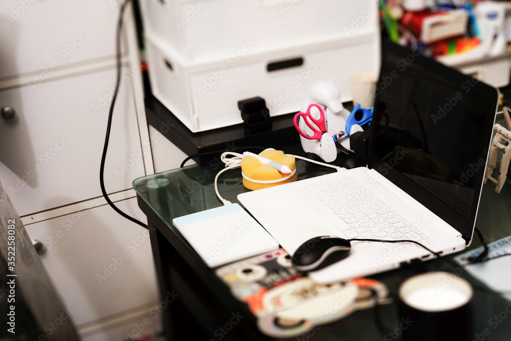 notebook and gadgets on eating table with pen mouse for covid-19 working at home notebook and gadgets on eating table with pen mouse for covid-19 working at home
