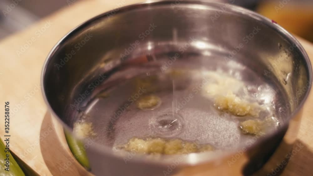 Close Up of Chef Pouring Honey and Vinegar Sauce on Ginger Close Up of Chef Pouring Honey and Vinegar Sauce on Ginger