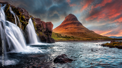 Fototapeta Naklejka Na Ścianę i Meble -  Scenic image of Iceland. Incredible Nature scenery during sunset. Great view on famous Mount Kirkjufell with Colorful, dramatic sky. popular plase for photografers. Best famous travel locations.