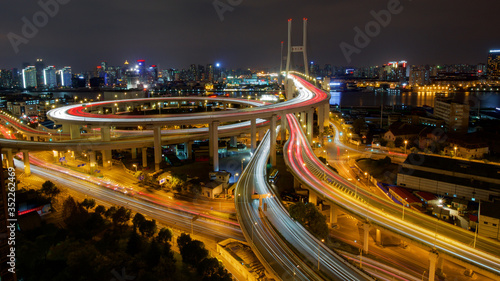 Shanghai Nanpu Bridge over Huangpu River with busy traffic in China.