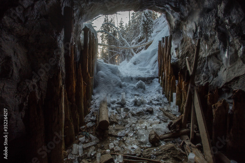 Underground old mica mine tunnel portal inside view