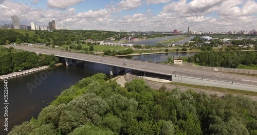 4K aerial summer late afternoon high quality video footage of new road highway, Grebnoi rowing water sports channel, cloudy sky in suburb Krilatskoye, Moscow River watercourse in Moscow, Russia photo