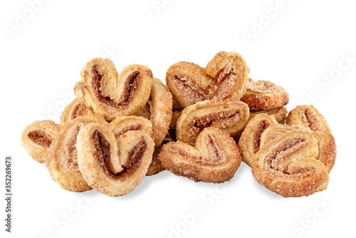 Palmier cookies with cinnamon from puff pastry ears isolated on a white background