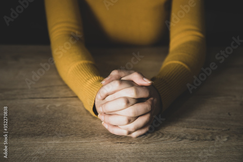 prayer woman in dark background