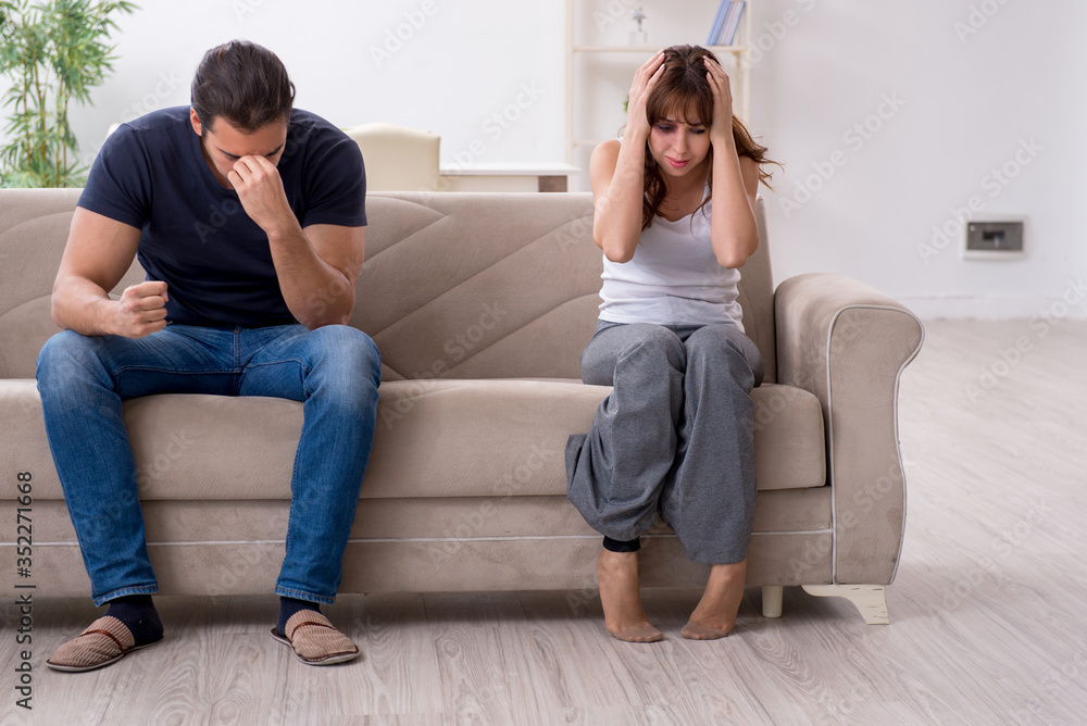Young couple in domestic violence concept Young couple in domestic violence concept