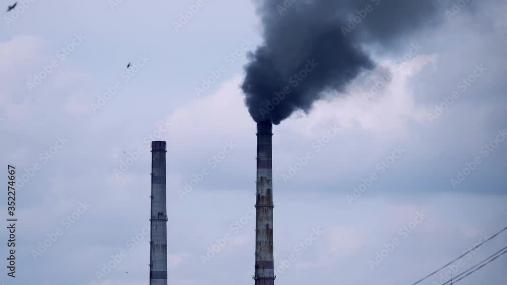 Factory pipes with smoke. Smoke of pipes pollutes atmosphere Factory pipes with smoke. Smoke of pipes pollutes atmosphere