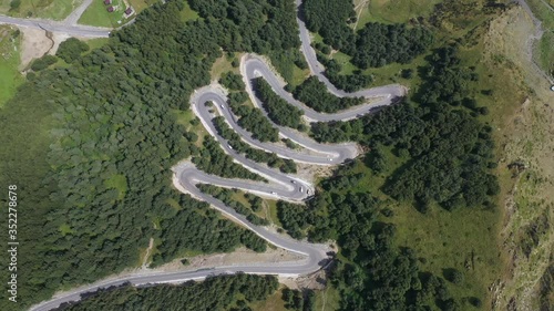 Spinning, Rotating Top Down Aerial Drone View of Amazing Road in Bakhmaro, Georgia photo