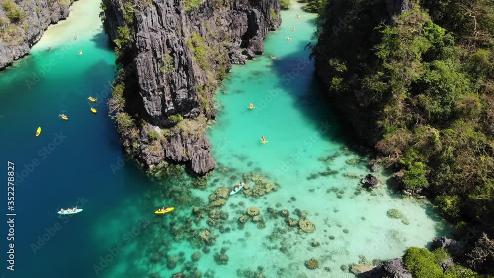 Kayaking in Philippines El Nido Islands on Exotic Vacation, Aerial Drone Kayaking in Philippines El Nido Islands on Exotic Vacation, Aerial Drone