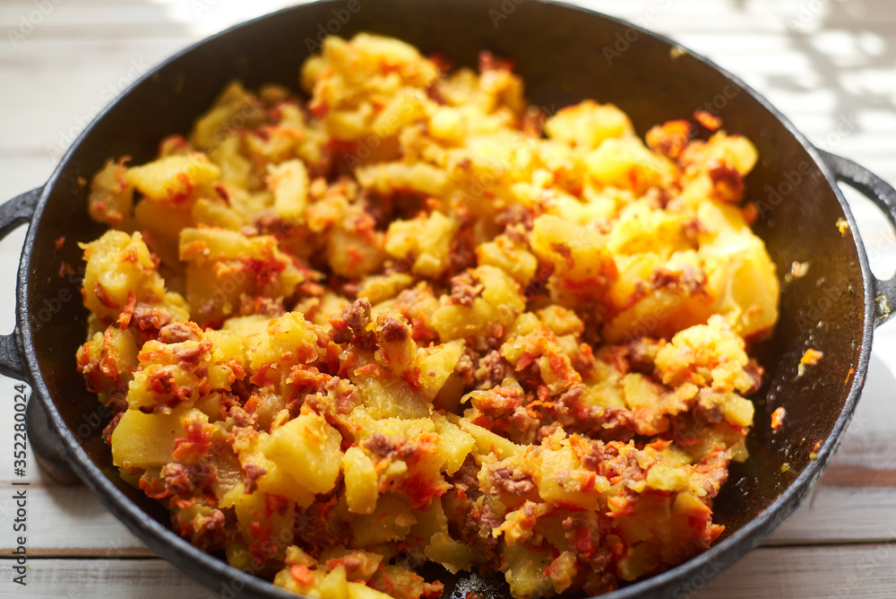 Baked potatoes with minced meat, onions and carrots baked in a pan. Baked potatoes with minced meat, onions and carrots baked in a pan.