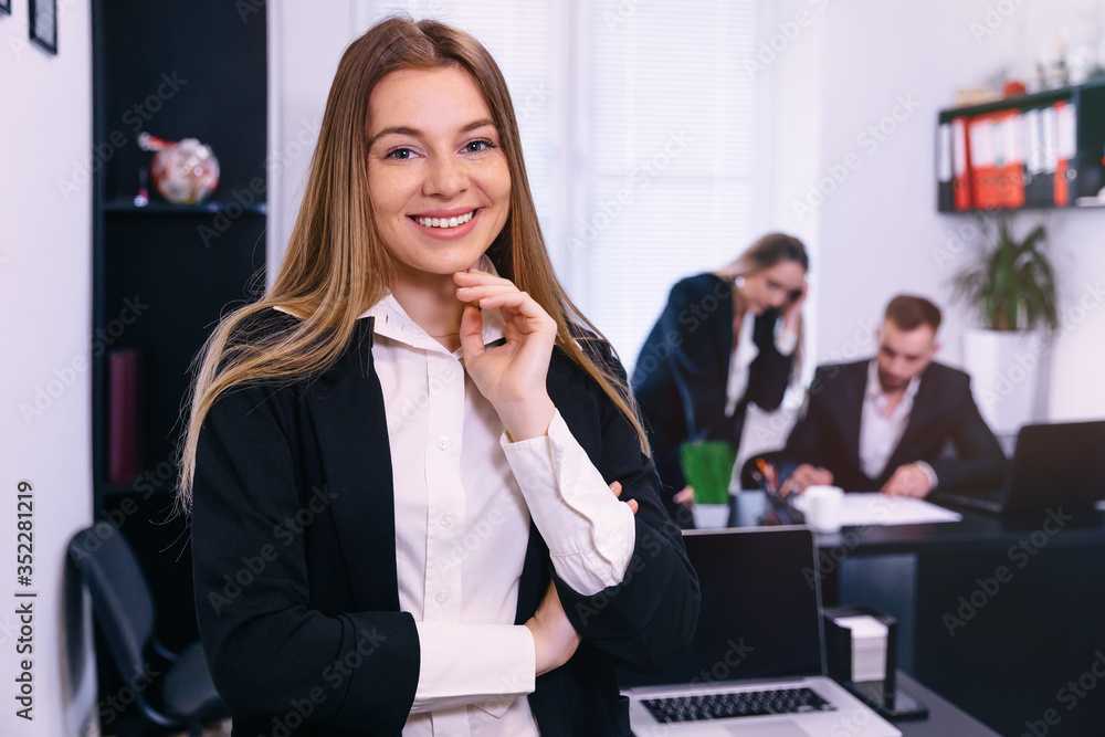 happy team leader, mentor smiling in office. smile at camera wit happy team leader, mentor smiling in office. smile at camera wit