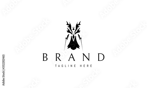 Vector logo on which an abstract image of an angel warrior with two swords. photo