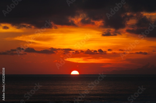 Stunning dramatic sunset over the ocean. © Evgenii Starkov