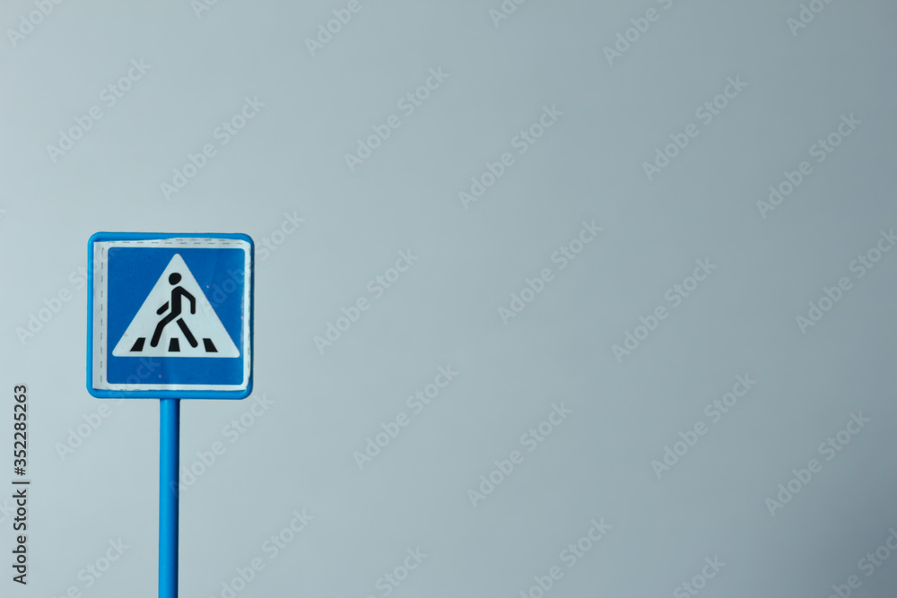 Plastic toy sign of crosswalk is on a white background Plastic toy sign of crosswalk is on a white background