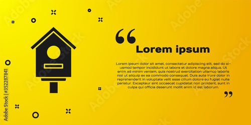 Black Bird house icon isolated on yellow background. Nesting box birdhouse, homemade building for birds. Vector