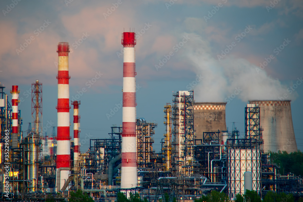 A working petrochemical plant at sunset. Industrial landscape