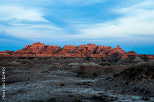 Landscape view of a colorful sunset in Badlands National Park in South Dakota .