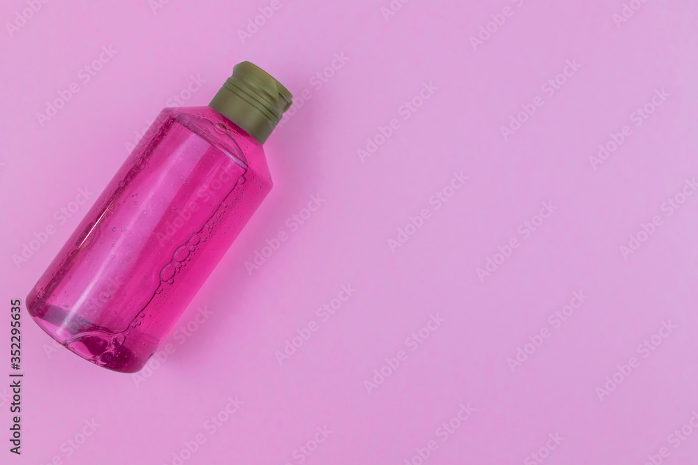 Facial or body wash gel on pink background Facial or body wash gel on pink background