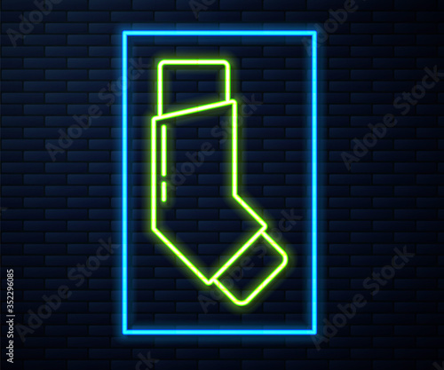 Glowing neon line Inhaler icon isolated on brick wall background. Breather for cough relief, inhalation, allergic patient. Vector