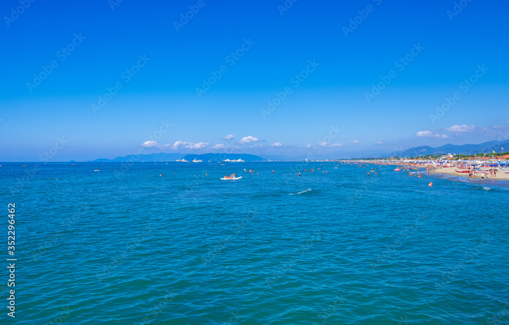 Forte dei Marmi, Italy - August 18, 2019: Mediterranean Sea and Forte dei Marmi one of the most known and trendy seaside resorts in Tuscany and Italy Forte dei Marmi, Italy - August 18, 2019: Mediterranean Sea and Forte dei Marmi one of the most known and trendy seaside resorts in Tuscany and Italy