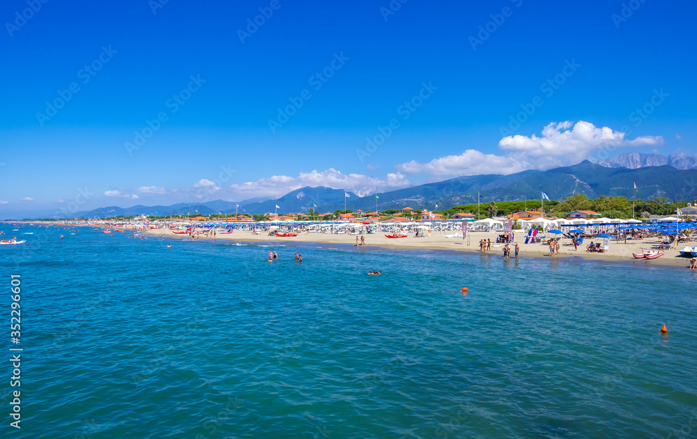 Forte dei Marmi, Italy - August 18, 2019: Mediterranean Sea and Forte dei Marmi one of the most known and trendy seaside resorts in Tuscany and Italy