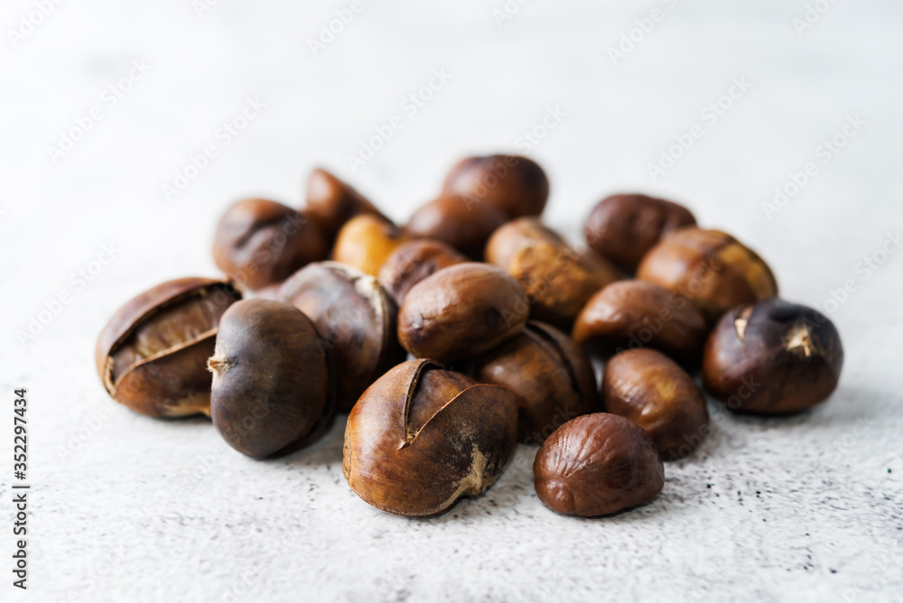 Chestnuts peeled and peeled in a white bowl