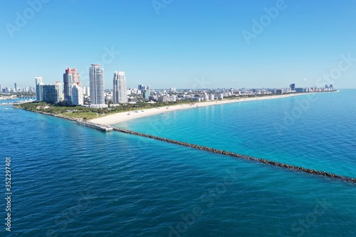 Aerial view of South Beach, South Pointe Park and Government Cut in Miami Beach, Florida on clear sunny summer morning.