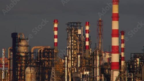 A working petrochemical plant at sunset. Industrial landscape
