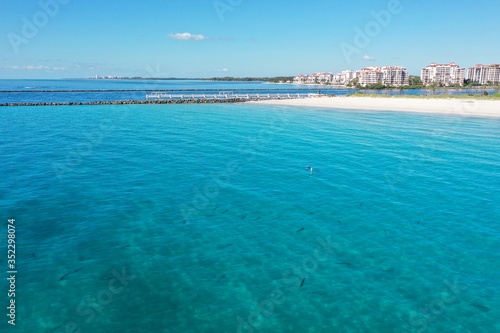 Aerial view of South Beach, South Pointe Park and Government Cut in Miami Beach, Florida on clear sunny summer morning.