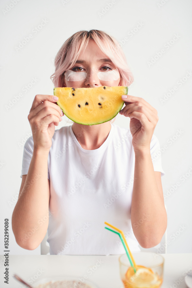 Funny woman with yellow watermelon like smile Funny woman with yellow watermelon like smile